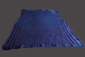 An Afghan for Two Celtic weave with Celtic braids on the long edges