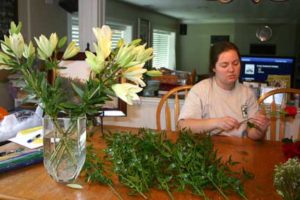 DIY Bridesmaid Flowers Wrapping flower stems with wire to strengthen them in the bouquet.