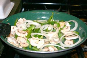 Gluten Free Loaded French Dip Sandwiches Sauteing mushrooms, green pepper and onion