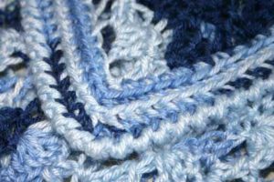 Snapdragon crochet baby blanket with railroad border