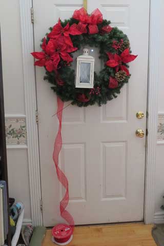 Christmas Lantern Wreath- find the configuration of berries, pinecones and ribbon puffs, you like